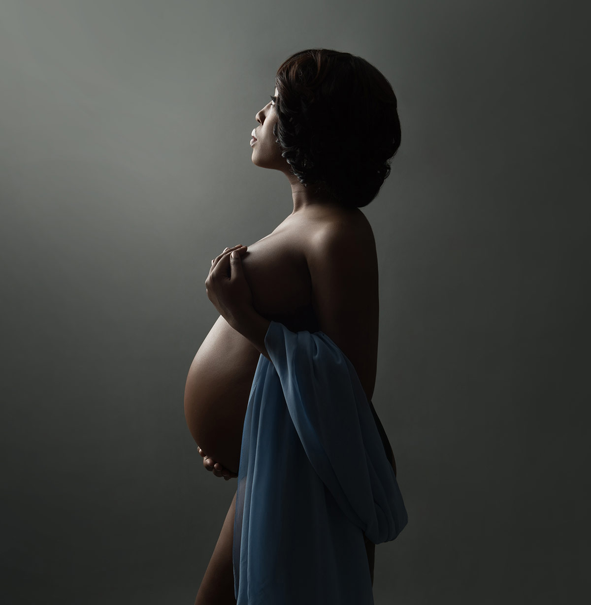 Maternity portrait of a woman in a NYC photo studio