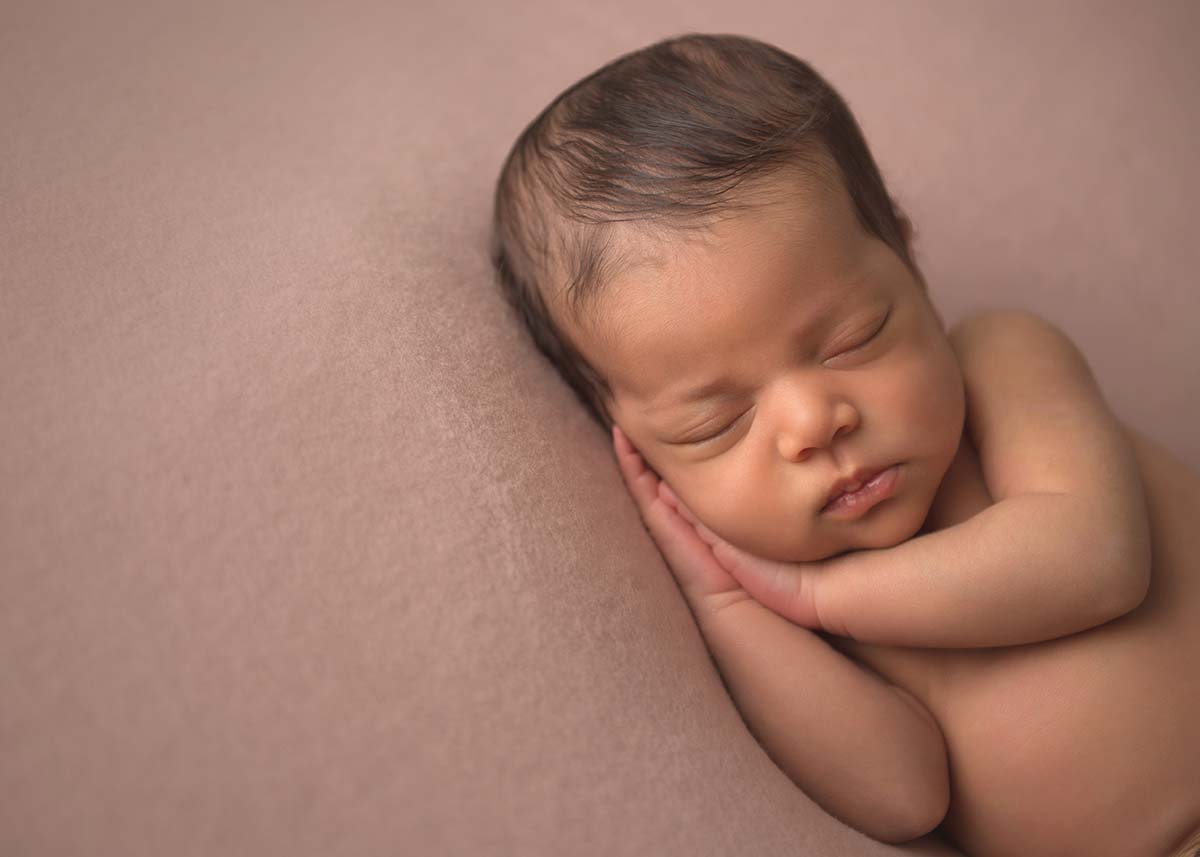 Beautiful newborn photo of a boy sleeping