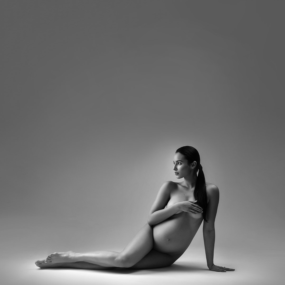 pregnant nude woman on floor Glow Portraits NYC Newborn & Maternity Photography