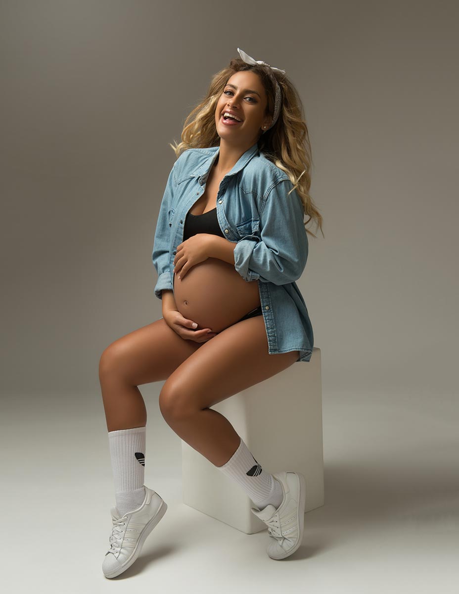 Candid maternity photo with sneakers