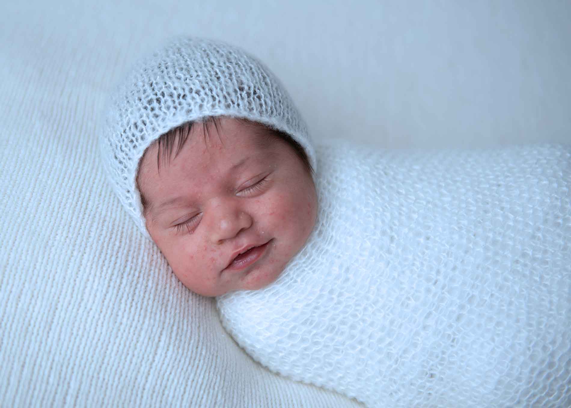 Closeup photo of a sleepy newborn