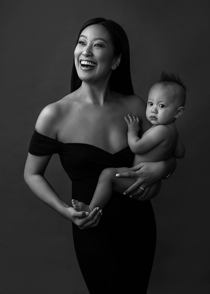 Black and White portrait of a happy mother and her baby