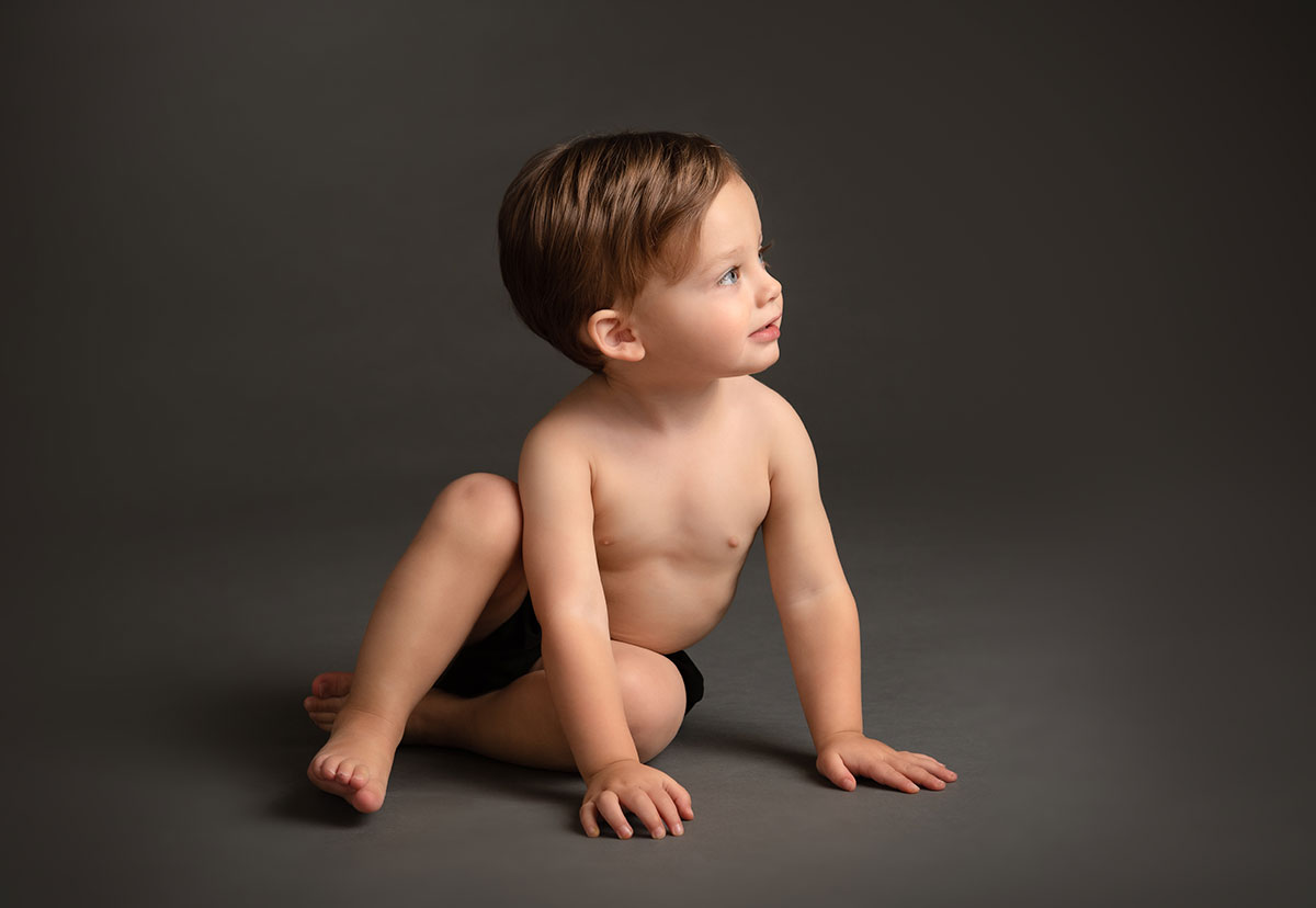 Boy playing on the floor of a photo studio in NYC