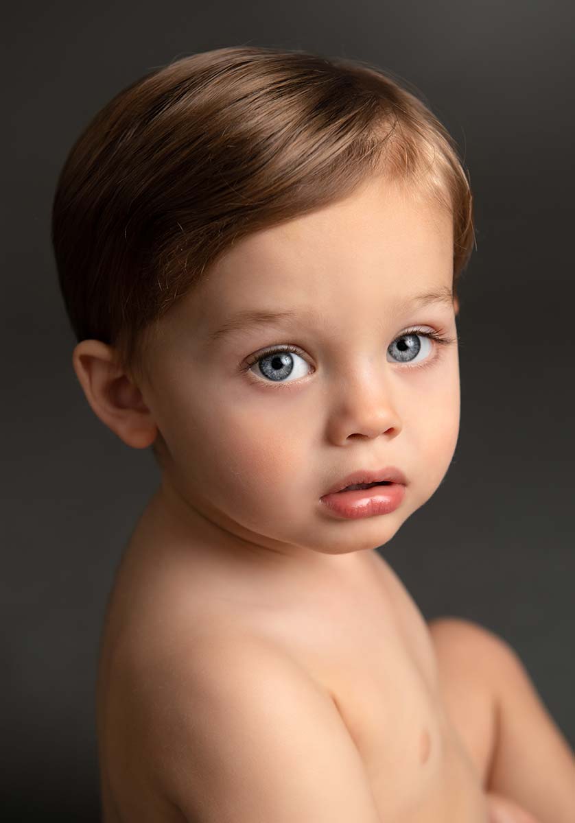 Handsome little boy with blue eyes looking at the camera