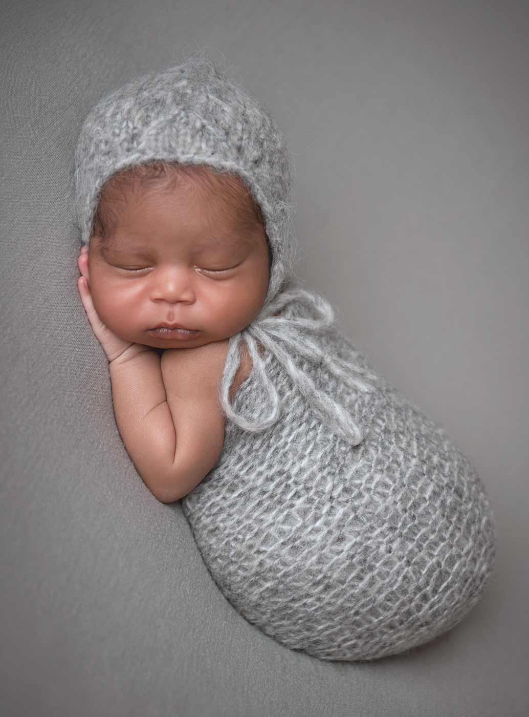 cozy swaddle and knit hat baby infant sleeping nyc