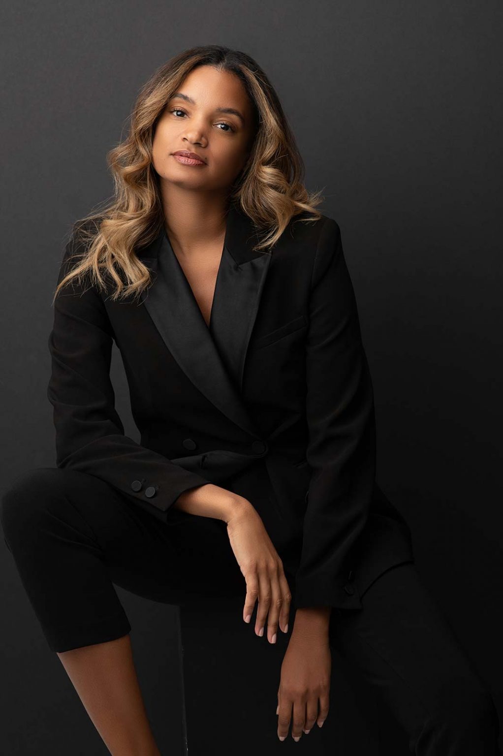 Woman wearing casual business attire in NYC photo studio