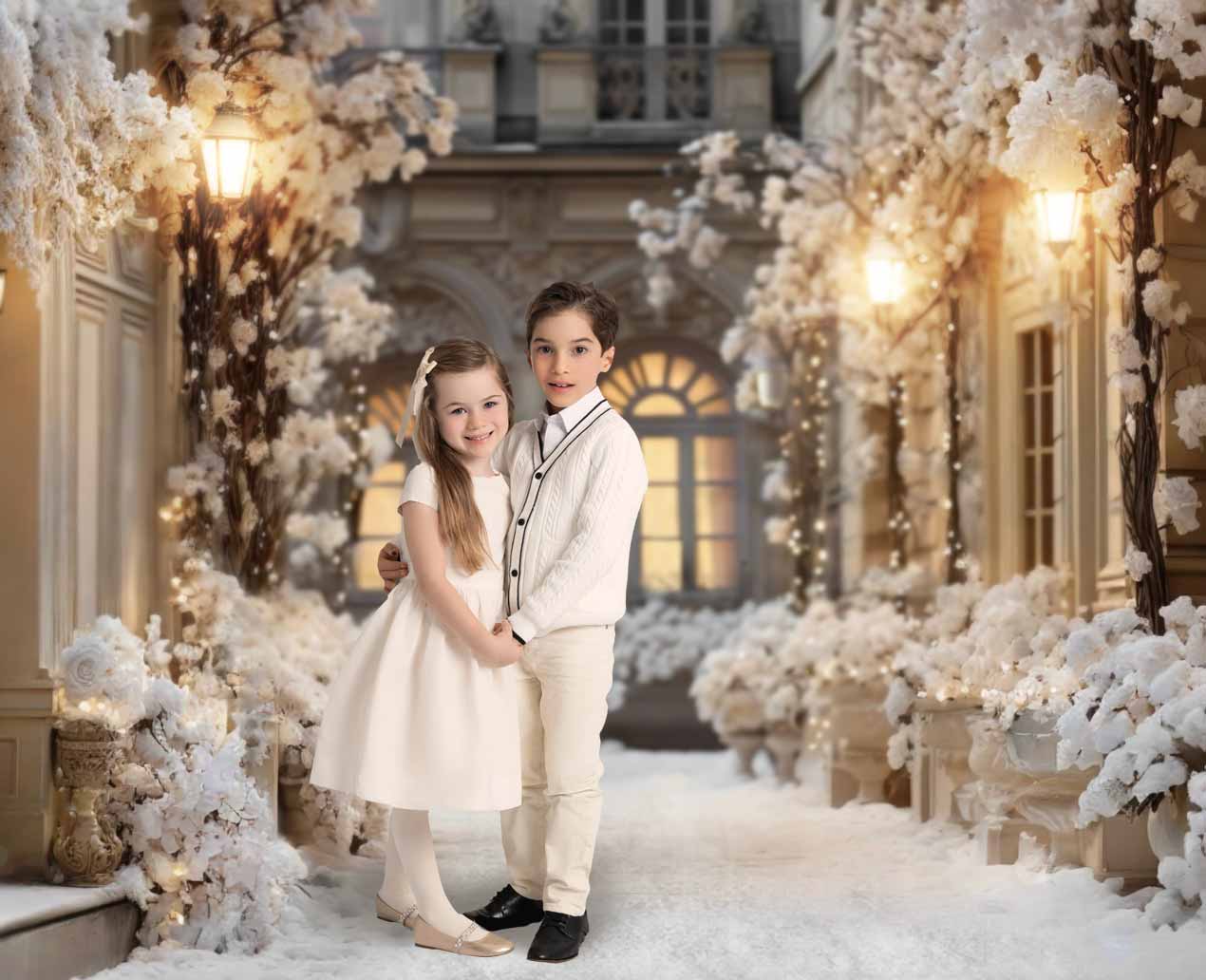An enchanting Parisian street in winter, complete with Christmas decor featuring two children posing for a portrait.